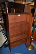 A floor standing bookcase - 23" wide x 6¾" depth x 51½" high.