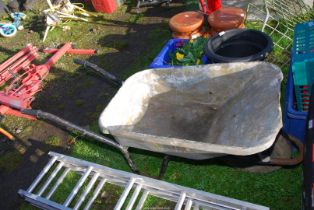 A wheelbarrow with pneumatic tyre.