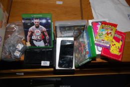 An iPhone, DS games console, and games, including Xbox and playstation games.
