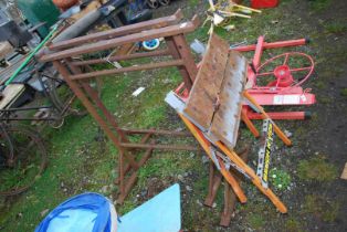 A Workmate and a pair of plastering trestles.