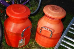 Two plastic style milk churns.