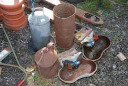 A chicken drinker, two containers, and two double cattle drinkers.