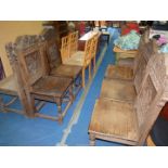 A set of Seven matched heavy banquet chairs with carved backs in various styles..