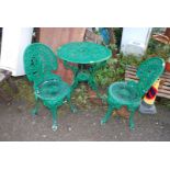 A circular cast iron/aluminum table and two chairs -27" wide x 28" high.