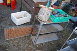 A roll of barbed wire, three shelf Dexion shelving, a tray of ratchets straps and brackets,