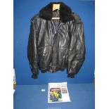 A black leather flying jacket with detachable fur collar and having the Batman logo on the back,