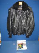 A black leather flying jacket with detachable fur collar and having the Batman logo on the back,