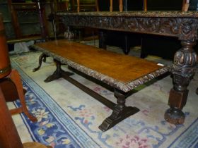 An Oak Bench/coffee Table, the top having carving to match the table in the previous lot,