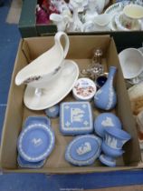 A quantity of Wedgwood blue Jasperware to include bud vases, trinket pots, plated cruet set, etc.