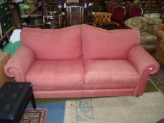 A terracotta coloured fabric upholstered 2/3 seater settee (one arm fabric a/f.).