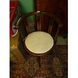An Edwardian Corner Chair with curved back, lightwood stringing.
