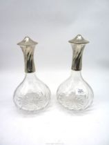 A pair of decanters having French pewter necks and lids, lids marked 'Les Etains du Rouergue'.