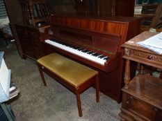 An upright matt Mahogany cased Model Rondo piano by Fuchs & Mohr having a 6 1/4" octave keyboard