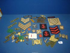 A quantity of military buttons and fabric patches including U.S Army, Royal Corps of Signals etc.