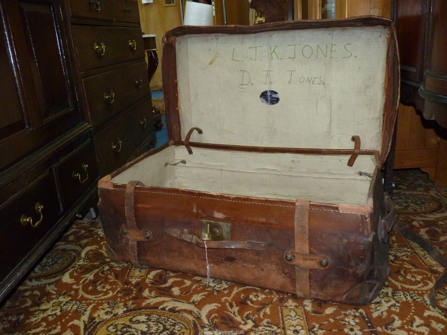 A brown leather suitcase marked 'Junior Army & Navy Ltd' with remnants of railway labels, - Image 5 of 5