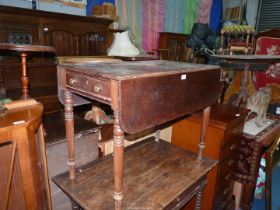 A circa 1900 Mahogany Pembroke Table standing on turned legs and having a drawer to one end,