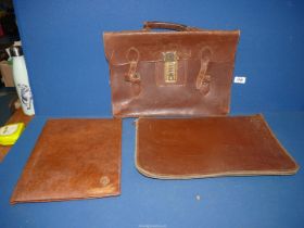 A leather briefcase and document holder.