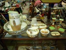 A Royal Doulton Dickens' ware bedroom set of wash jug (a/f) and bowl, a soap dish,