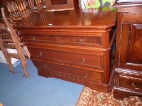 A contemporary satinwood finished Chest of three long Drawers and having canted corners,