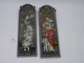 A pair of interesting multicoloured painted continental glass panels of Ladies in the Pre -