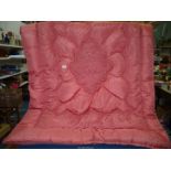 A single pink Eiderdown with ruched and emboidered pattern ,some marks.