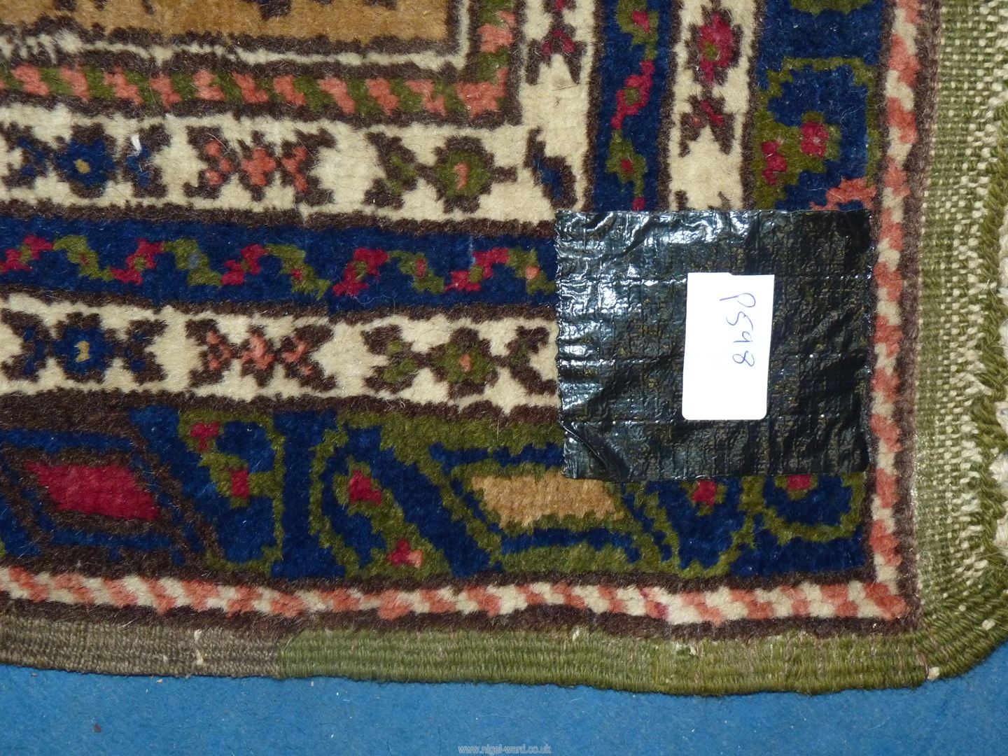 A bordered, patterned and fringed Rug in navy, green and terracotta colours, 72'' x 46''. - Image 3 of 3