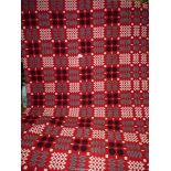 A large red reversible Welsh blanket, 89'' x 75''.