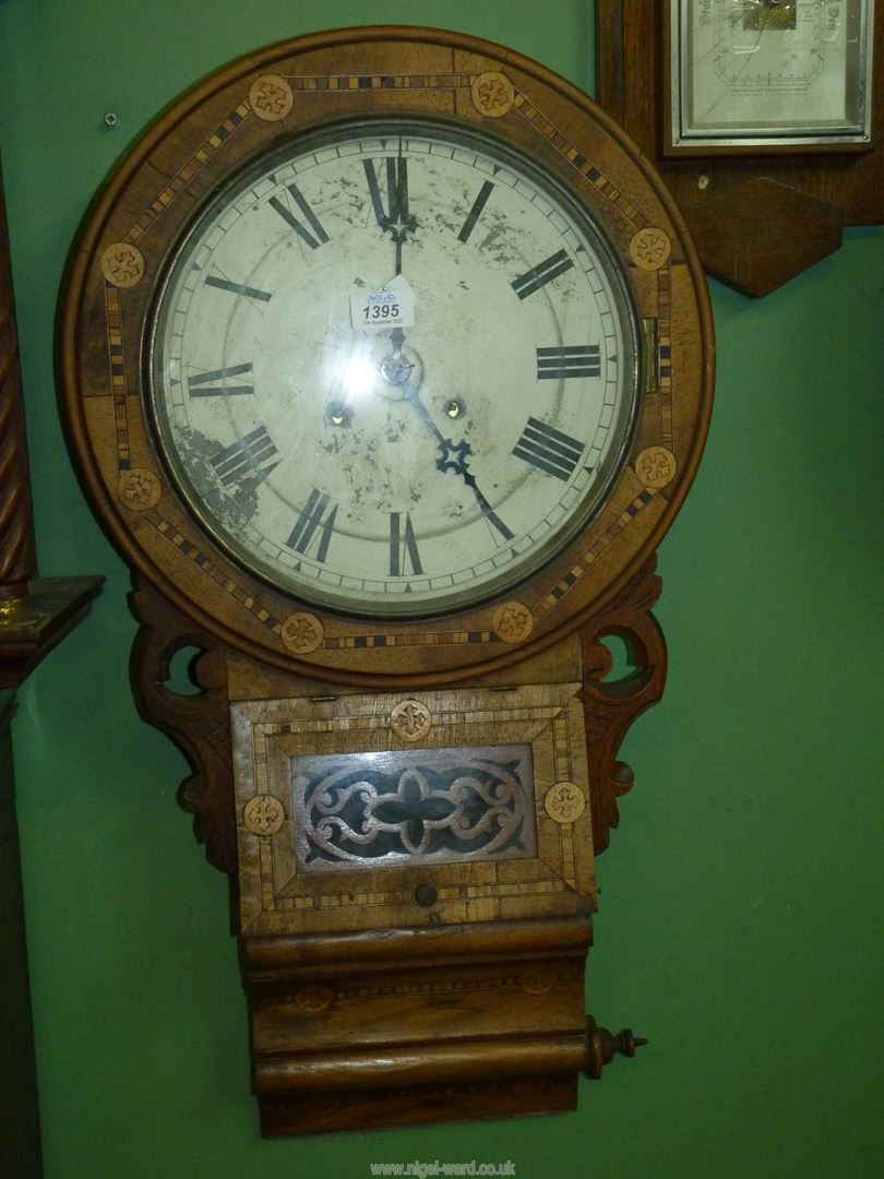 An inlaid Walnut and other woods Wall Clock having a two train spring driven movement (running at