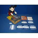 A plastic and tinplate Mickey Mouse figure playing a Xylophone, stamped W.D.