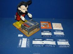 A plastic and tinplate Mickey Mouse figure playing a Xylophone, stamped W.D.