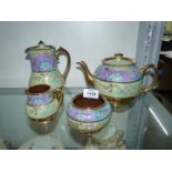 A 20th century Sadler teapot, milk jug, sugar basin and hot water jug (chip to lid).