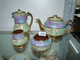A 20th century Sadler teapot, milk jug, sugar basin and hot water jug (chip to lid).