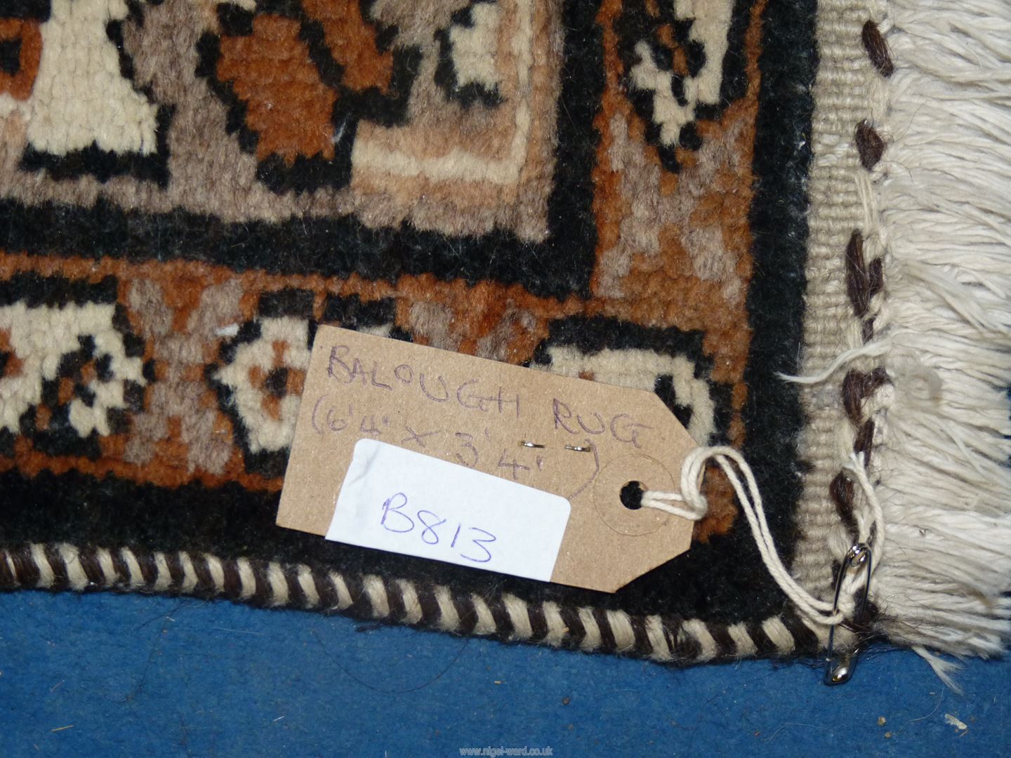 A handmade Balouch rug in browns and creams, 6' 4" x 3' 4". - Image 3 of 3