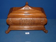 A 'Freedom of The City of Hereford' wooden box with hinged lid and four paw feet having carved date