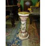A large Italian Capo di Monte Pedestal stand with raised decoration of figures in a Bacchanalian