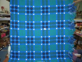 A large Derw reversible Welsh blanket in blue, 95'' x 79''.