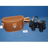 A pair of 'Claritas London' lightweight 8 x 25 binoculars in brown leather case.