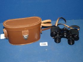 A pair of 'Claritas London' lightweight 8 x 25 binoculars in brown leather case.