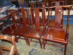 A set of eight Eastern/Chinoiserie* hardwood dining chairs including two carvers standing on turned