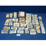 A quantity of cigarette cards to include; Famous Footballers, Butterflies of the World,