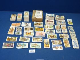 A quantity of cigarette cards to include; Famous Footballers, Butterflies of the World,