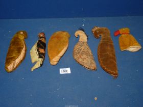 A small collection of velvet tropical birds, possibly finger puppets.