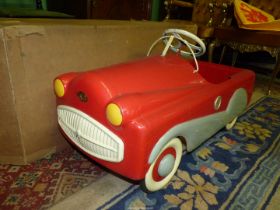 A vintage Tri-ang Toys Mobo T60 red and cream metal Pedal Car with original box.