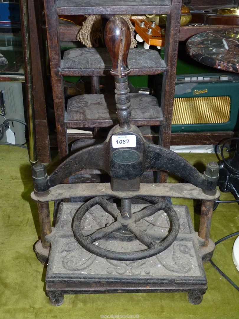 A 'Patrick Ritchie Edinburgh' cast iron book press (handle a/f), 14" wide x 9" deep x 19 1/4" high.