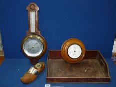 A 'Negretti & Zambra' barometer London on a carved oak base, wall hanging,