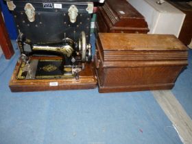 A hand crank Singer sewing machine in working condition,