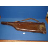 A leather Leg o' Mutton gun case.