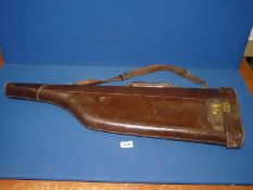 A leather Leg o' Mutton gun case.