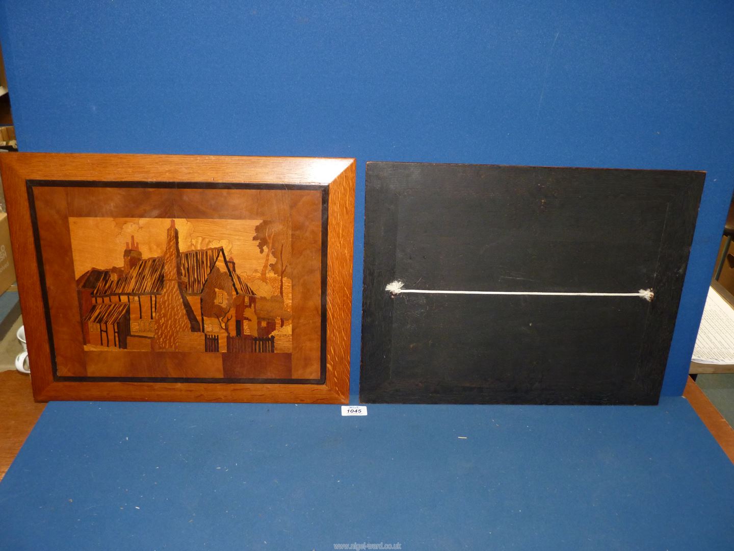 A pair of 20th century treen marquetry panels depicting period houses in mixed woods, - Image 2 of 2
