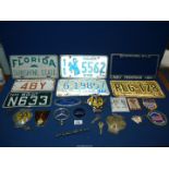 A small quantity of car badges including A.A, Mercedes. Ford etc plus American style number plates.